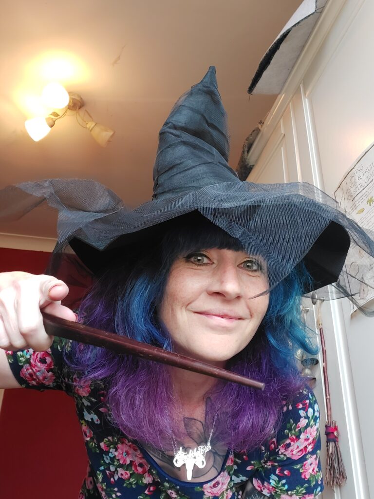 An actual witch waving her actual magic wand doing actual witchcraft